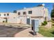 Exterior shot displaying well-maintained stucco facades and community parking, offering convenient access for residents at 5201 N 42Nd N Pkwy, Phoenix, AZ 85019