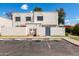 Charming white stucco townhome featuring private parking and a landscaped yard at 5201 N 42Nd N Pkwy, Phoenix, AZ 85019