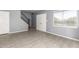 Open layout showcasing stairs, a large window, and tiled floors in the living area at 5201 N 42Nd N Pkwy, Phoenix, AZ 85019