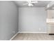Bright living room featuring neutral paint, ceramic floors, and a ceiling fan at 5201 N 42Nd N Pkwy, Phoenix, AZ 85019