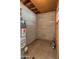 Unfinished basement featuring a water heater, exposed utilities, and concrete block walls at 524 W Fairway Dr # 9, Mesa, AZ 85201