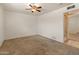 Comfortable bedroom featuring neutral carpet and an open doorway, offering a welcoming space at 524 W Fairway Dr # 9, Mesa, AZ 85201