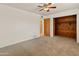 Inviting bedroom with carpet, a view of the closet, and an open doorway, ready for personalization at 524 W Fairway Dr # 9, Mesa, AZ 85201