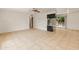 Spacious living room featuring tile floors, ceiling fan and sliding glass door to the backyard at 524 W Fairway Dr # 9, Mesa, AZ 85201