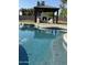 A sparkling blue swimming pool with an adjacent gazebo, perfect for relaxation and outdoor entertainment at 5430 E Shea Blvd, Scottsdale, AZ 85254