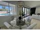 Bright dining area with views of the pool, modern lighting, and an inviting atmosphere at 5430 E Shea Blvd, Scottsdale, AZ 85254
