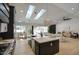 Open kitchen and living space offers plenty of natural light from skylights and backyard view at 5430 E Shea Blvd, Scottsdale, AZ 85254