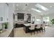 Bright kitchen with white and dark cabinets and a large central island with marble countertops at 5430 E Shea Blvd, Scottsdale, AZ 85254