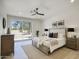 Comfortable main bedroom with a ceiling fan, a rug, and access to a private outdoor patio at 5430 E Shea Blvd, Scottsdale, AZ 85254