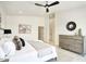 Bright main bedroom with hardwood floors, a decorative ceiling fan, and comfortable furniture at 5430 E Shea Blvd, Scottsdale, AZ 85254