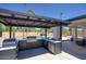 Well-equipped outdoor kitchen featuring stainless steel appliances, ample counter space, and a covered dining area at 5430 E Shea Blvd, Scottsdale, AZ 85254