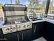 Well-equipped outdoor kitchen with a grill and countertop, perfect for entertaining at 5430 E Shea Blvd, Scottsdale, AZ 85254