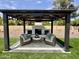 Backyard gazebo featuring a fireplace with comfortable seating for enjoying outdoor relaxation and entertainment at 5430 E Shea Blvd, Scottsdale, AZ 85254