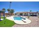 Beautiful backyard featuring a refreshing pool, diving board, patio, and lush landscaping at 5430 E Shea Blvd, Scottsdale, AZ 85254