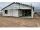 New construction exterior shows the backyard and a sliding glass door to the home at 5507 W Piedmont Rd, Laveen, AZ 85339