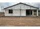 New construction exterior shows the backyard and a sliding glass door to the home at 5507 W Piedmont Rd, Laveen, AZ 85339
