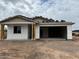 New construction exterior shows a home with an attached two car garage and desert landscaping at 5507 W Piedmont Rd, Laveen, AZ 85339