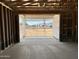 View from a framed garage looking towards the front yard and neighborhood homes at 5507 W Piedmont Rd, Laveen, AZ 85339