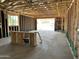 Interior view shows exposed framing with connections and a future view of the backyard at 5507 W Piedmont Rd, Laveen, AZ 85339