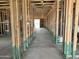 Interior view shows a home under construction with exposed framing and a concrete floor at 5507 W Piedmont Rd, Laveen, AZ 85339