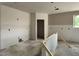 Unfinished room features smooth drywall, a closet, and a window with views of the outdoors at 5507 W Piedmont Rd, Laveen, AZ 85339
