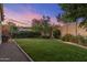 Landscaped backyard featuring a well-maintained lawn and garden area at 5512 E Barwick Dr, Cave Creek, AZ 85331