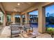 Inviting covered patio with ceiling fans and desert landscaping creating an ideal outdoor space at 5512 E Barwick Dr, Cave Creek, AZ 85331