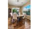 Bright dining room with wood floors and views of the backyard at 5512 E Barwick Dr, Cave Creek, AZ 85331
