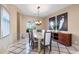 Dining room with an oval table, chairs, overhead chandelier and wall art at 5512 E Barwick Dr, Cave Creek, AZ 85331