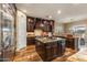 Chef's kitchen with a large island, custom cabinetry, and stainless steel appliances at 5512 E Barwick Dr, Cave Creek, AZ 85331