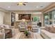 Open concept living room flowing into the kitchen, offering comfortable seating and natural light at 5512 E Barwick Dr, Cave Creek, AZ 85331