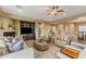 Inviting living room with tile floors, a fireplace, and comfortable seating arrangement at 5512 E Barwick Dr, Cave Creek, AZ 85331