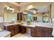 The main bathroom boasts dual vanities and a large window overlooking the backyard at 5512 E Barwick Dr, Cave Creek, AZ 85331