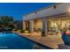 Inviting patio with lush landscaping and pool, seamlessly integrating indoor and outdoor living at 5512 E Barwick Dr, Cave Creek, AZ 85331