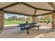 Covered picnic area in the park, with stone supports and a metal picnic table and benches at 5512 E Barwick Dr, Cave Creek, AZ 85331