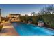 Sparkling pool with an outdoor kitchen and water features at 5512 E Barwick Dr, Cave Creek, AZ 85331
