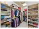 Walk-in closet has built-in shelving and clothing racks at 5512 E Barwick Dr, Cave Creek, AZ 85331