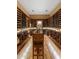 A climate controlled wine cellar with space for many bottles of wine and a tasting table at 5512 E Barwick Dr, Cave Creek, AZ 85331