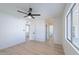 Large bedroom with light wood floors, and large windows at 5534 W Calavar Rd, Glendale, AZ 85306