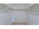 Walk-in closet with rods for hanging clothes, offering ample storage and organization options at 5534 W Calavar Rd, Glendale, AZ 85306
