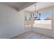 Bright dining area with wood floors, and a charming chandelier at 5534 W Calavar Rd, Glendale, AZ 85306