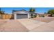 This single story home with a 2 car garage has a well maintained front yard at 5534 W Calavar Rd, Glendale, AZ 85306