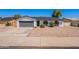 Charming single-story home featuring a well-maintained front yard and a two-car garage at 5534 W Calavar Rd, Glendale, AZ 85306