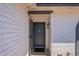 Inviting front entry with a white brick facade and a stylish security door at 5534 W Calavar Rd, Glendale, AZ 85306
