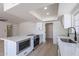 Bright kitchen with a stainless steel oven, white countertops, and plenty of cabinet space at 5534 W Calavar Rd, Glendale, AZ 85306