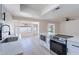 Beautiful, updated kitchen with stainless appliances, white cabinetry, and wood floors at 5534 W Calavar Rd, Glendale, AZ 85306