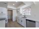 Bright kitchen featuring white cabinets, stainless steel appliances, and modern fixtures at 5534 W Calavar Rd, Glendale, AZ 85306