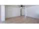 Spacious living room featuring contemporary wood-look flooring and ample natural light at 5534 W Calavar Rd, Glendale, AZ 85306