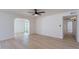 Open-concept living room featuring wood floors, and a arched opening to a backyard view at 5534 W Calavar Rd, Glendale, AZ 85306
