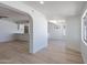 Spacious living area showcasing an open layout to kitchen and dining areas at 5534 W Calavar Rd, Glendale, AZ 85306